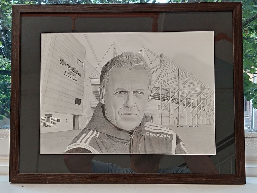 A framed graphite pencil portrait made by Ryan Jones